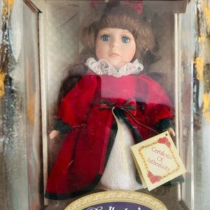 Porcelain Doll in box with Certificate from 1990s. Brand New condition.